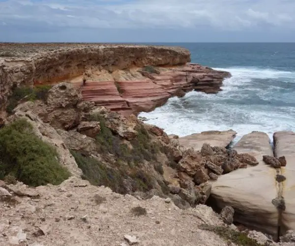 Cliffs and ocean surrounding Woolshed Cave